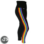 Load image into Gallery viewer, A pair of black spandex leggings on a mannequin, the leggings have a 3.5” wide stripe down the side that has a printed fabric with the stripes of the Philadelphia Pride Flag vertically, the stripes are black, brown, red, orange, yellow, green, blue &amp; purple. 
