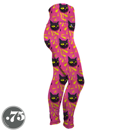 High-waisted, spandex Full Length pocket leggings. The fabric has a bright pink background with yellow triangle shapes and large hand drawn cat heads with yellow eyes.