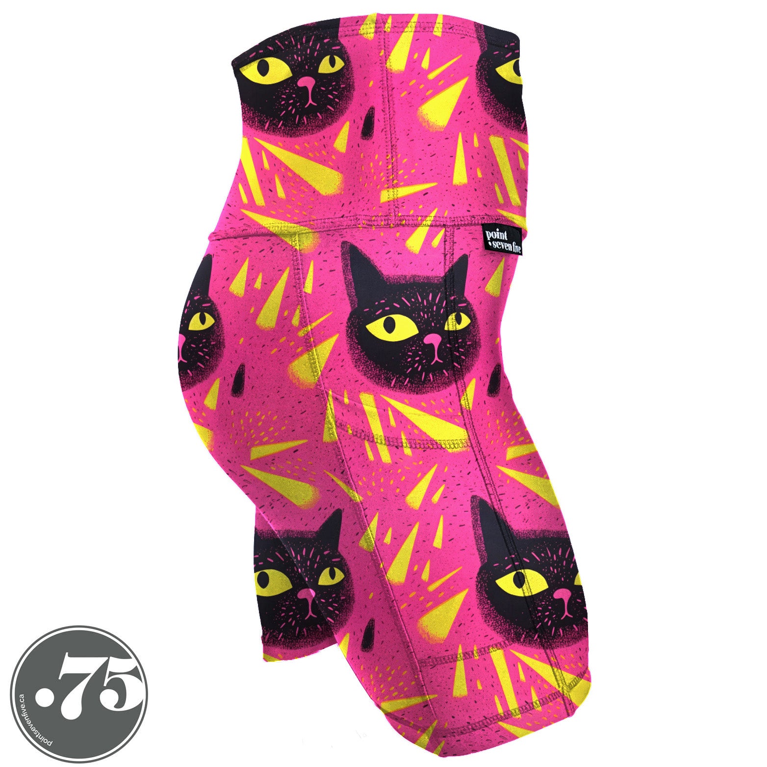 High-waisted, spandex Skate Length (bike short) pocket shorts. The fabric has a bright pink background with yellow triangle shapes and large hand drawn cat heads with yellow eyes.