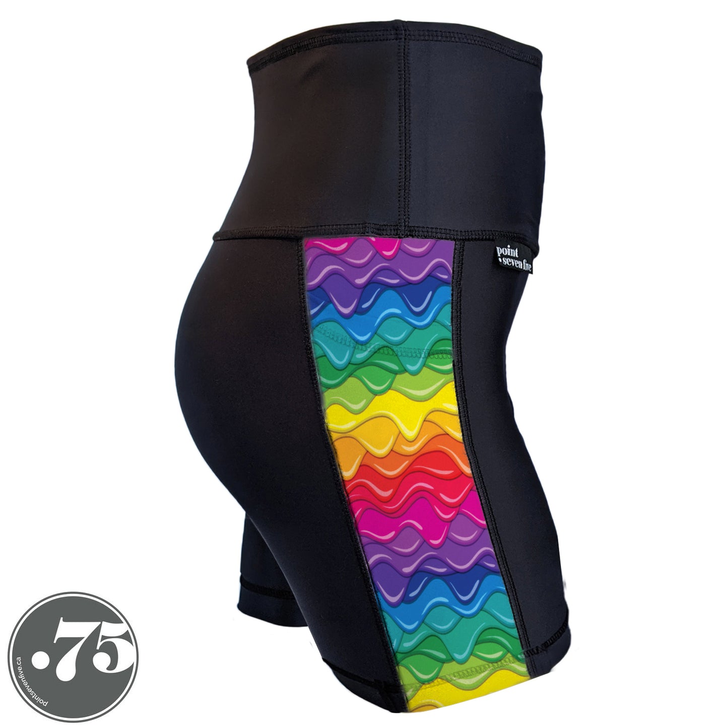 A pair of black spandex shorts against a white background. The shorts are short with a 5” inseam and have a panel on the side with a pocket, the panel has rows of dripping paint in different colours, red, pink, purple, blue, green, yellow and orange. 