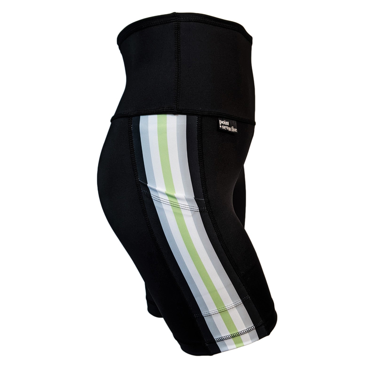 A pair of black spandex skate length shorts on a mannequin, the leggings have a 3.5” wide stripe down the side that has a printed fabric with vertical stripes in the colours of the Agender Pride Flag Black, Grey, White, Light Green, White Grey & Black. 