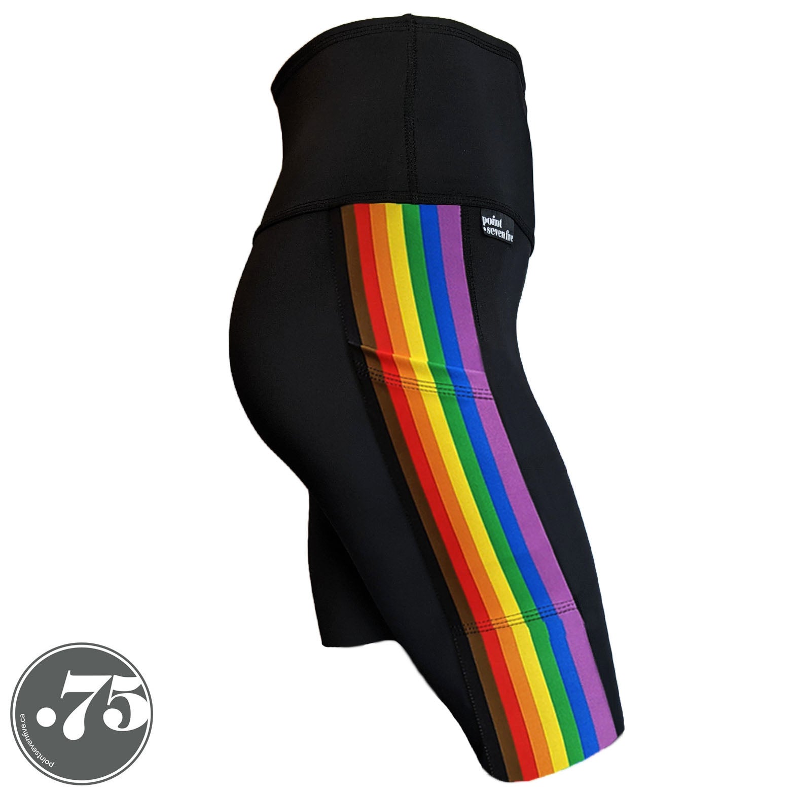 A pair of black spandex knee length shorts on a mannequin, the leggings have a 3.5” wide stripe down the side that has a printed fabric with the stripes of the Philadelphia Pride Flag vertically, the stripes are black, brown, red, orange, yellow, green, blue & purple. 