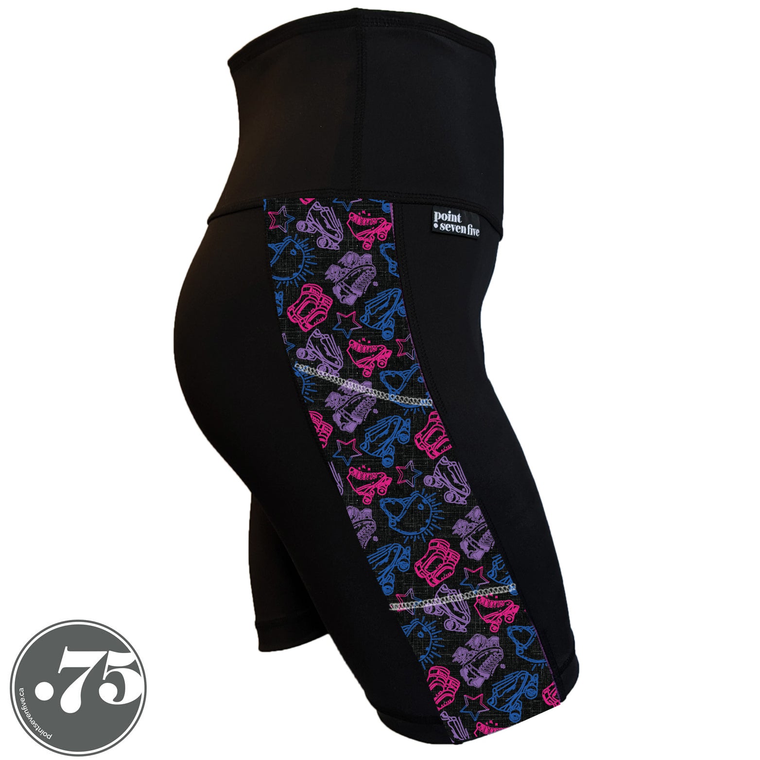 A pair of black spandex Skate length shorts on a mannequin, the leggings have a 3.5” wide stripe down the side that has a printed fabric with rollerskates, helmets, stars & knee pads. The graphics are in the colours of the Bi Pride Flag pink, purple and blue. 
