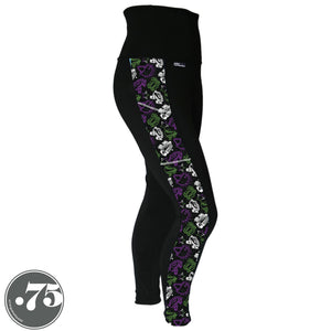 A pair of black spandex leggings on a mannequin, the leggings have a 3.5” wide stripe down the side that has a printed fabric with rollerskates, helmets, stars & knee pads. The graphics are in the colours of the Genderqueer Pride Flag green, purple and white. 