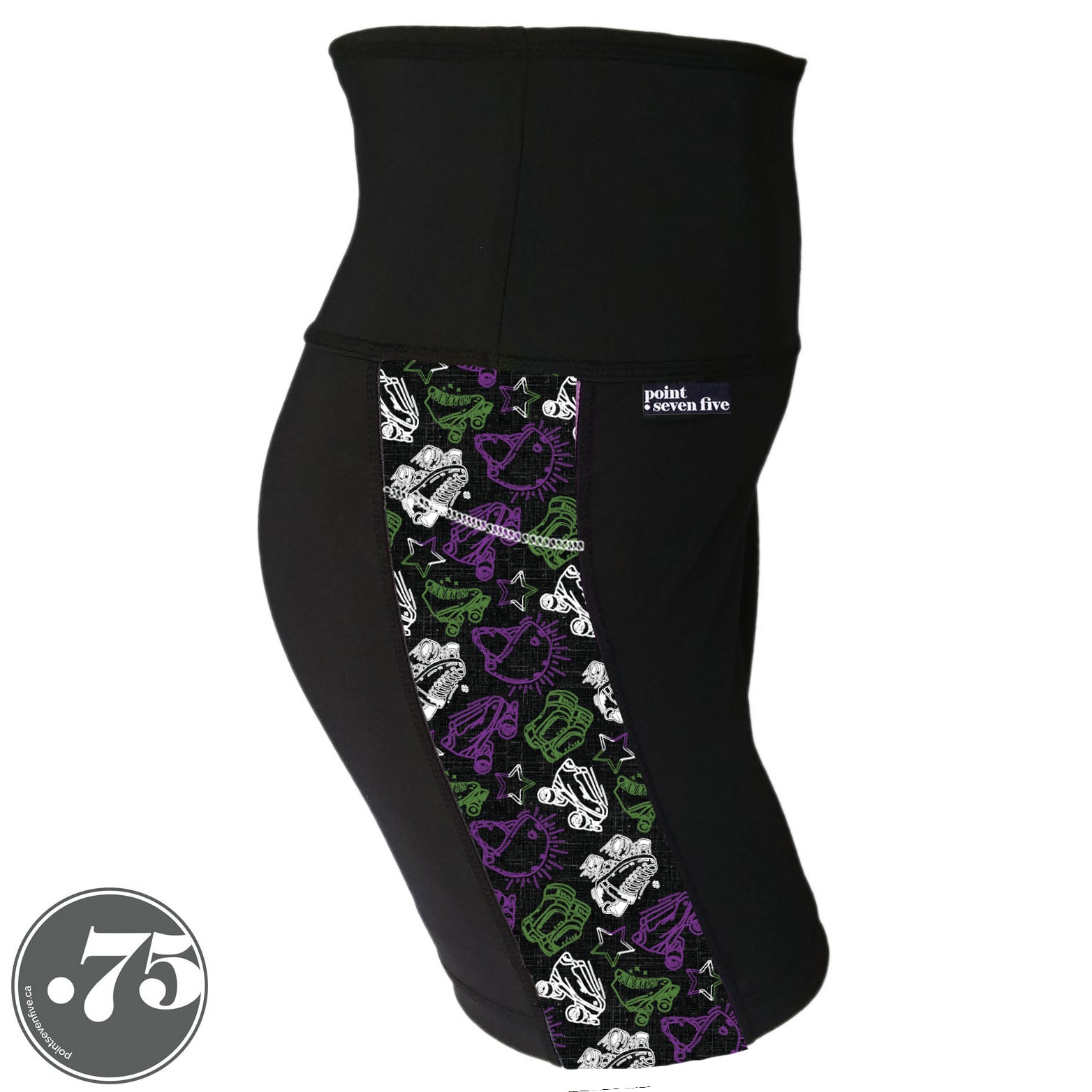 A pair of black spandex lift length shorts on a mannequin, the leggings have a 3.5” wide stripe down the side that has a printed fabric with rollerskates, helmets, stars & knee pads. The graphics are in the colours of the Genderqueer Pride Flag green, purple and white. 