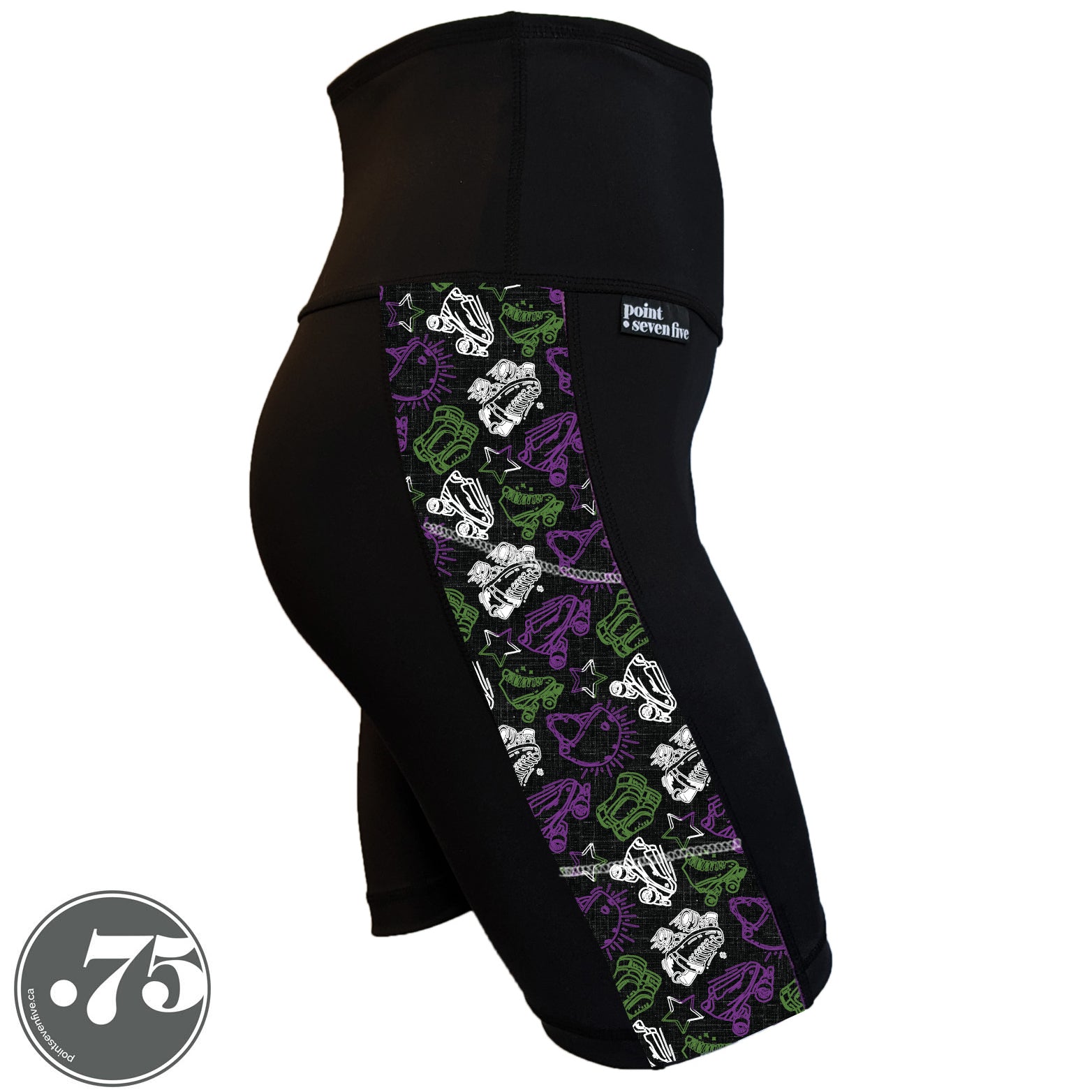 A pair of black spandex skate length shorts on a mannequin, the leggings have a 3.5” wide stripe down the side that has a printed fabric with rollerskates, helmets, stars & knee pads. The graphics are in the colours of the Genderqueer Pride Flag green, purple and white. 