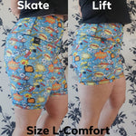 Load image into Gallery viewer, Two side by side images of myself wearing pairs of blue spandex shorts, a side view. The left is longer, the right is shorter. The captions read “Skate” on the top left, “Lift” on the top right, “Size L-Comfort” across the bottom.
